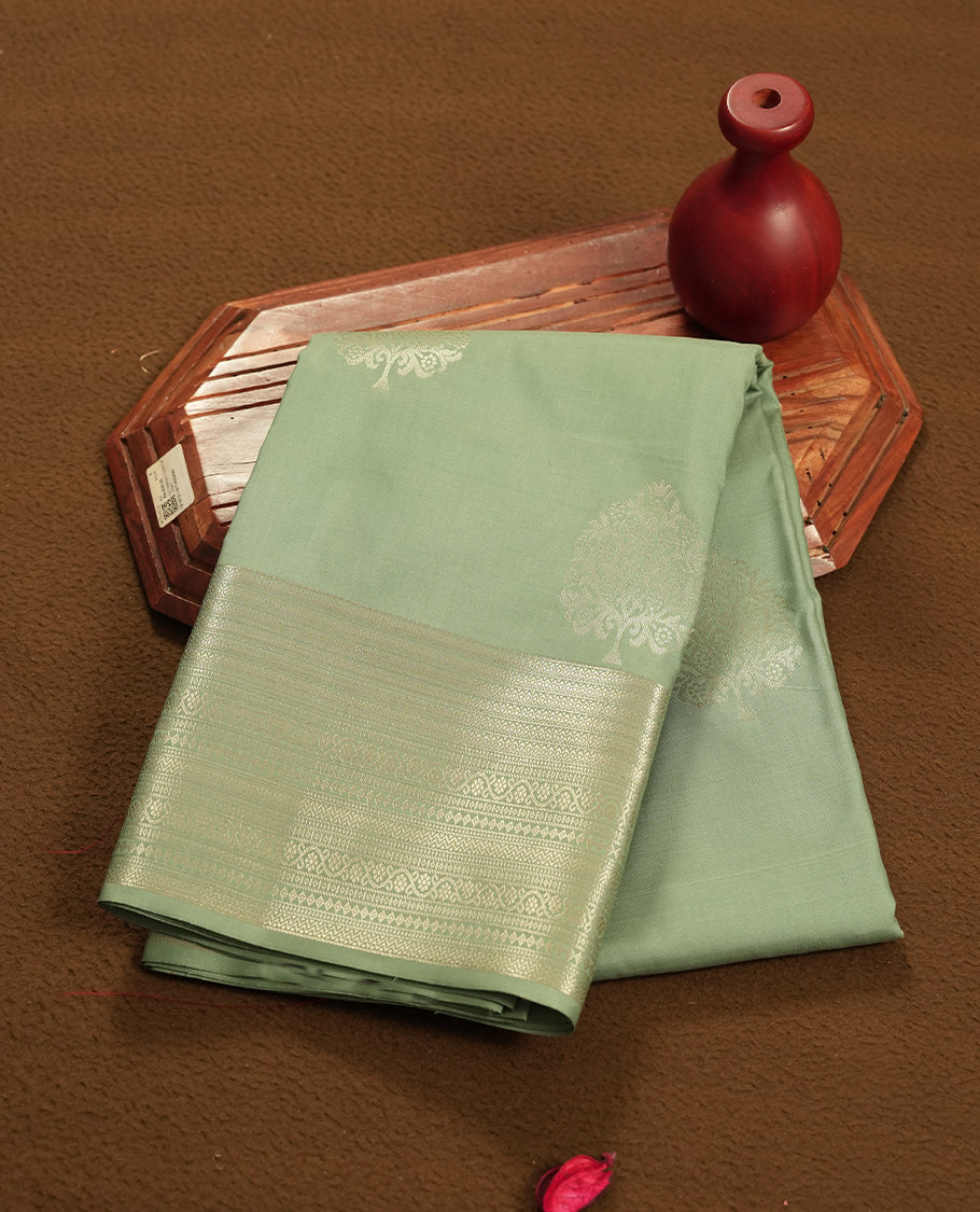 Pastel Mint colour semi soft silk saree featuring a self coloured golden textured patterned body, complemented by self coloured with gold traditional motifs on pallu & border and a matching blouse piece.