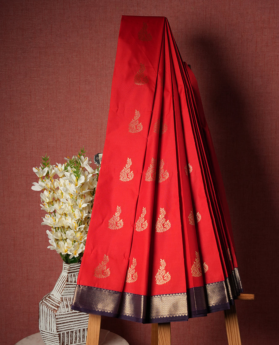 Red colour Semi Silk Saree with gold zari patterns on the body, paired with a contrasting dark purple traditional pallu and border, and a matching blouse piece.