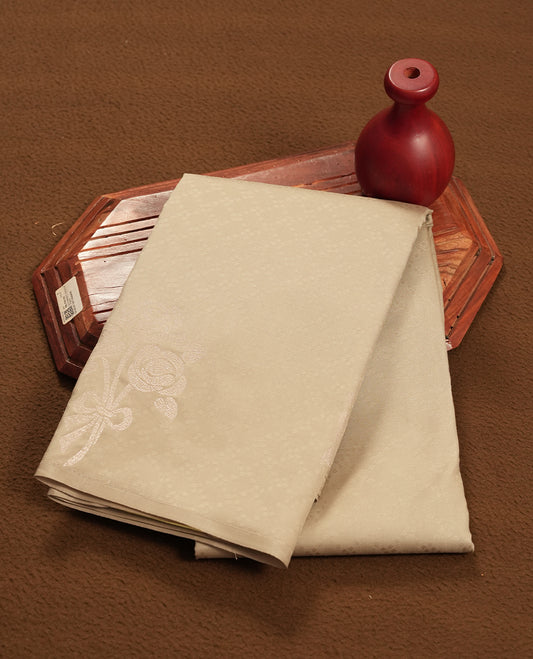 Gray stone colour semi soft silk saree featuring a self coloured textured patterned body, complemented by self coloured tiny diamond & floral motifes on pallu & border and a matching blouse piece.