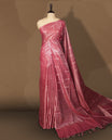 Onion pink colour semi jute saree featuring subtle dotted woven patterns on the body, complemented by a shimmering pallu & Comes with a matching blouse piece for a complete look.