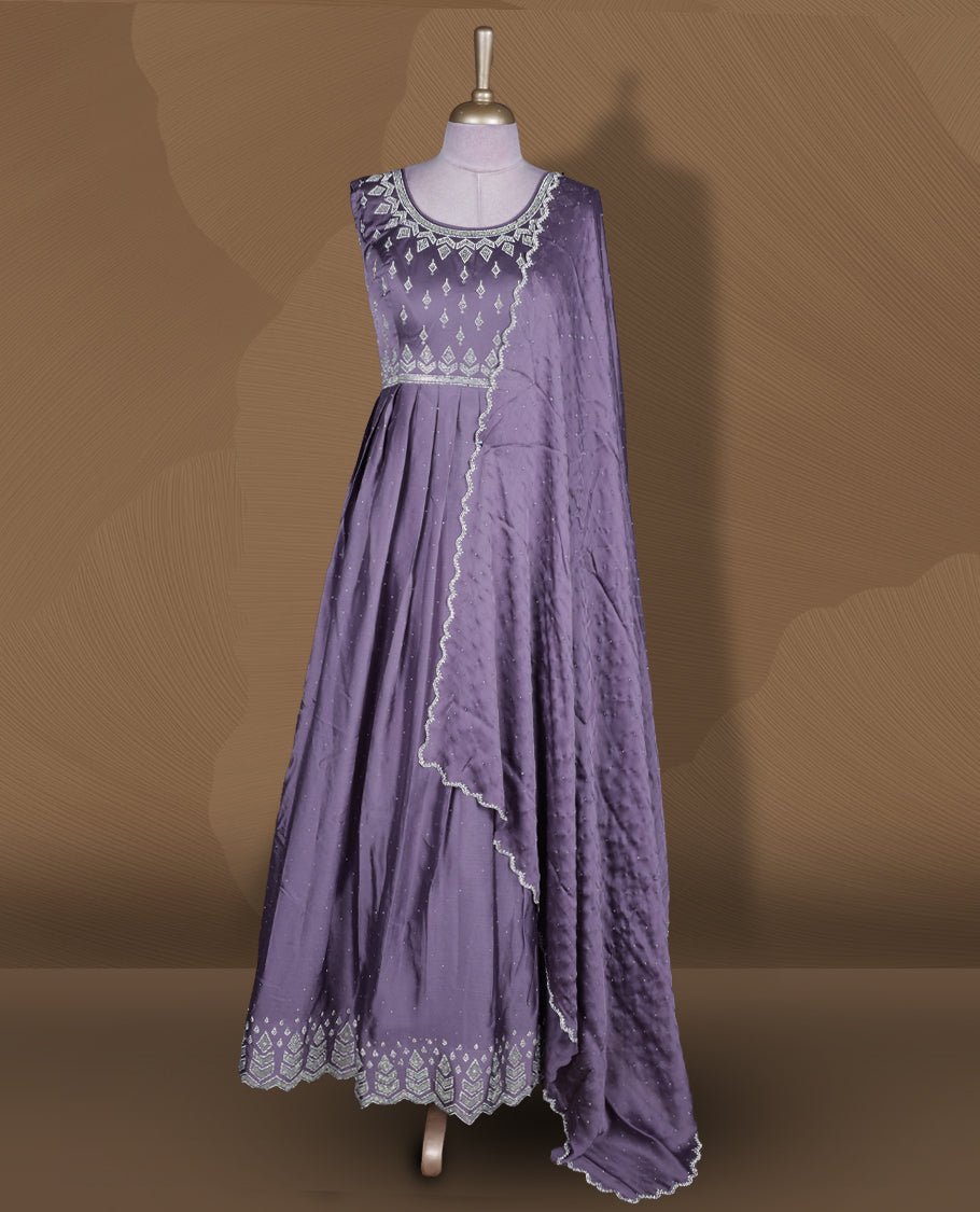 Dusty purple colour stitched gown set with sleeveless embroidered yoke, flared ankle‑length silhouette, and attached dupatta edged with scalloped beadwork and matching embroidered hem.
