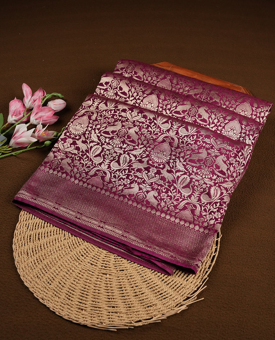 Dark Purple colour Mysore Crepe Silk saree fearturing gold Zari kodi visiri & Animal brocade pattern on body and self colour border paired with matching blouse