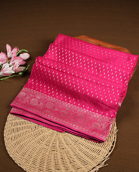 Rani pink colour banaras satin crepe saree fearturing gold tiny leaf motifs on body, kodi visiri pattern on border & pallu and paired with matching blouse