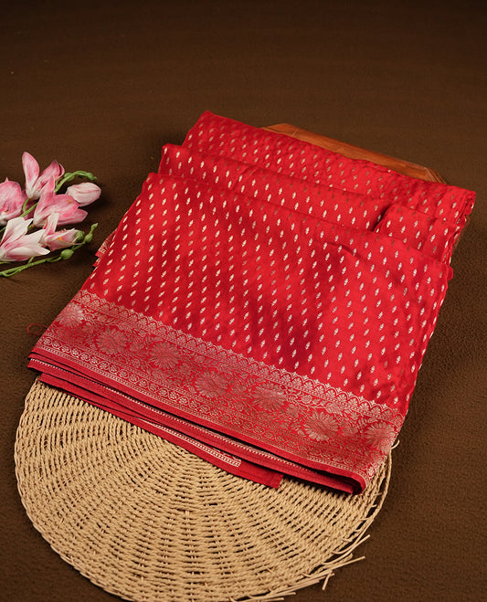 Bright red colour banaras satin crepe saree fearturing gold tiny leaf motifs on body, kodi visiri pattern on border & pallu and paired with matching blouse