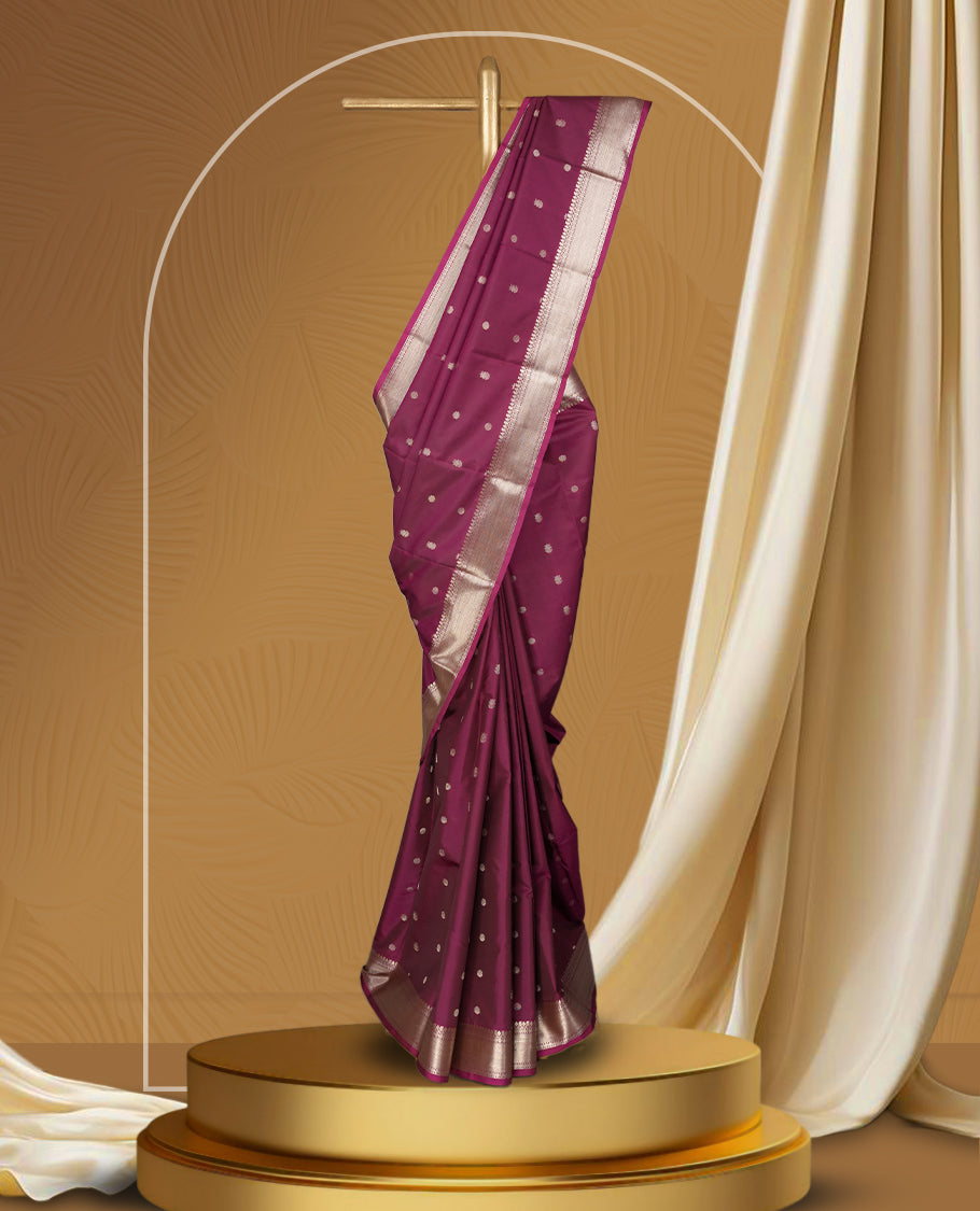 Mulberry colour soft silk saree featuring fawn gold colour buttas and a lustrous fawn gold colour zari border with matching pallu & Paired with a matching blouse.
