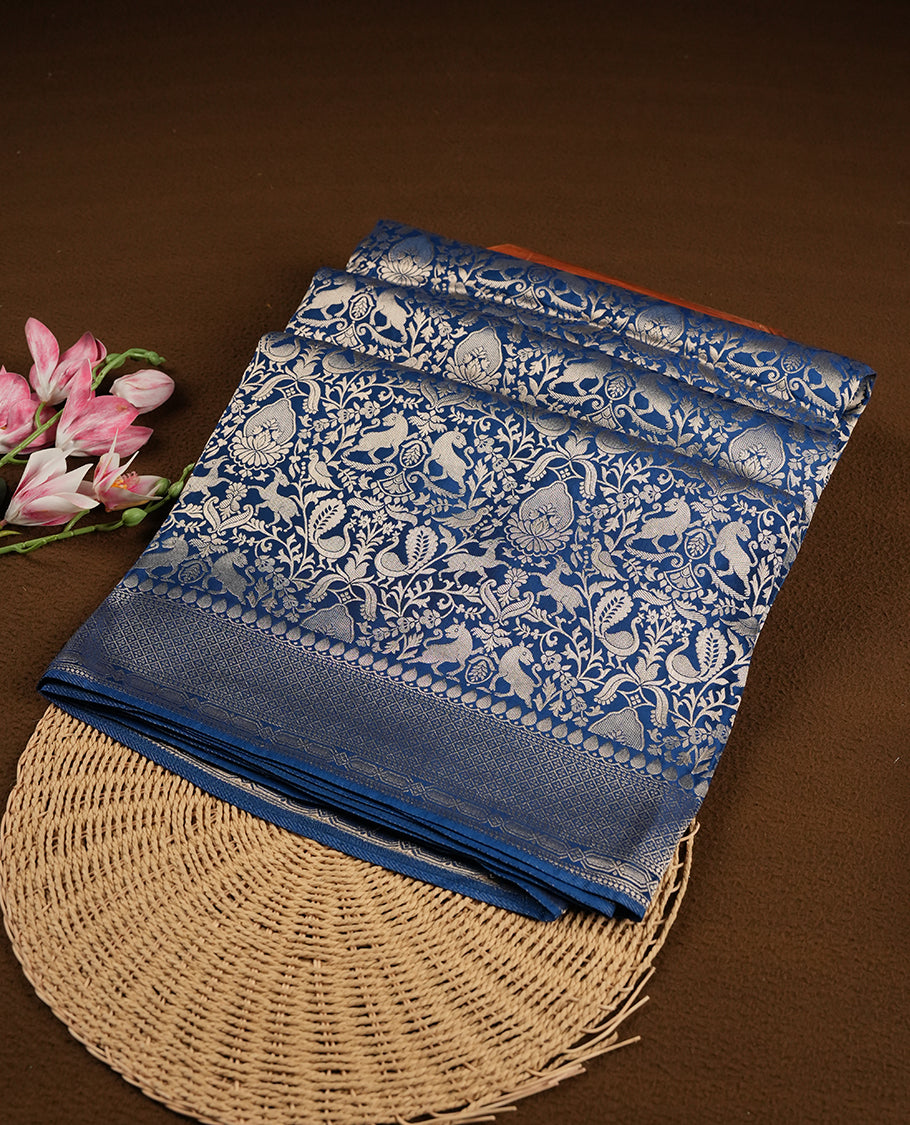 Dark Blue colour Mysore Crepe Silk saree fearturing gold zari kodi visiri & Animal brocade pattern on body and self colour border paired with matching blouse