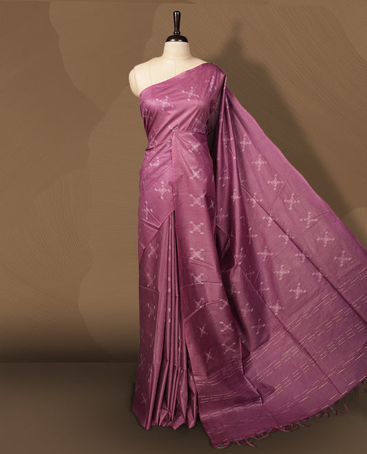 Mauve colour semi jute saree adorned with subtle thread motifs across the body & Features a soft sheen, woven geometric pallu, sleek border, and comes with a matching blouse piece for a graceful ensemble.