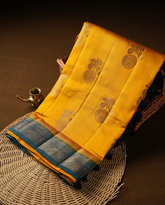 Mustard Colour Pure Banaras soft Silk Saree having gold floral motifs on Body with contrast Dark teal colour gold zari Border and matching Blouse