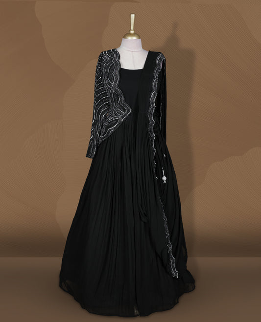 Black colour stitched gown set with sleeveless square‑neck bodice, attached pleated flare, and one‑side draped dupatta highlighted with heavy silver sequin and mirror work borders.
