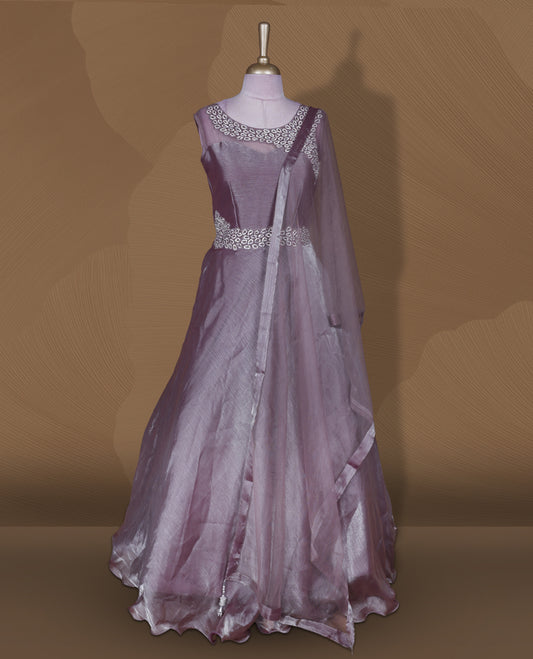 Dusty mauve colour stitched gown set with sleeveless embellished yoke, sheer studded back, flared layered hem with scalloped edge, and matching plain sheer dupatta.