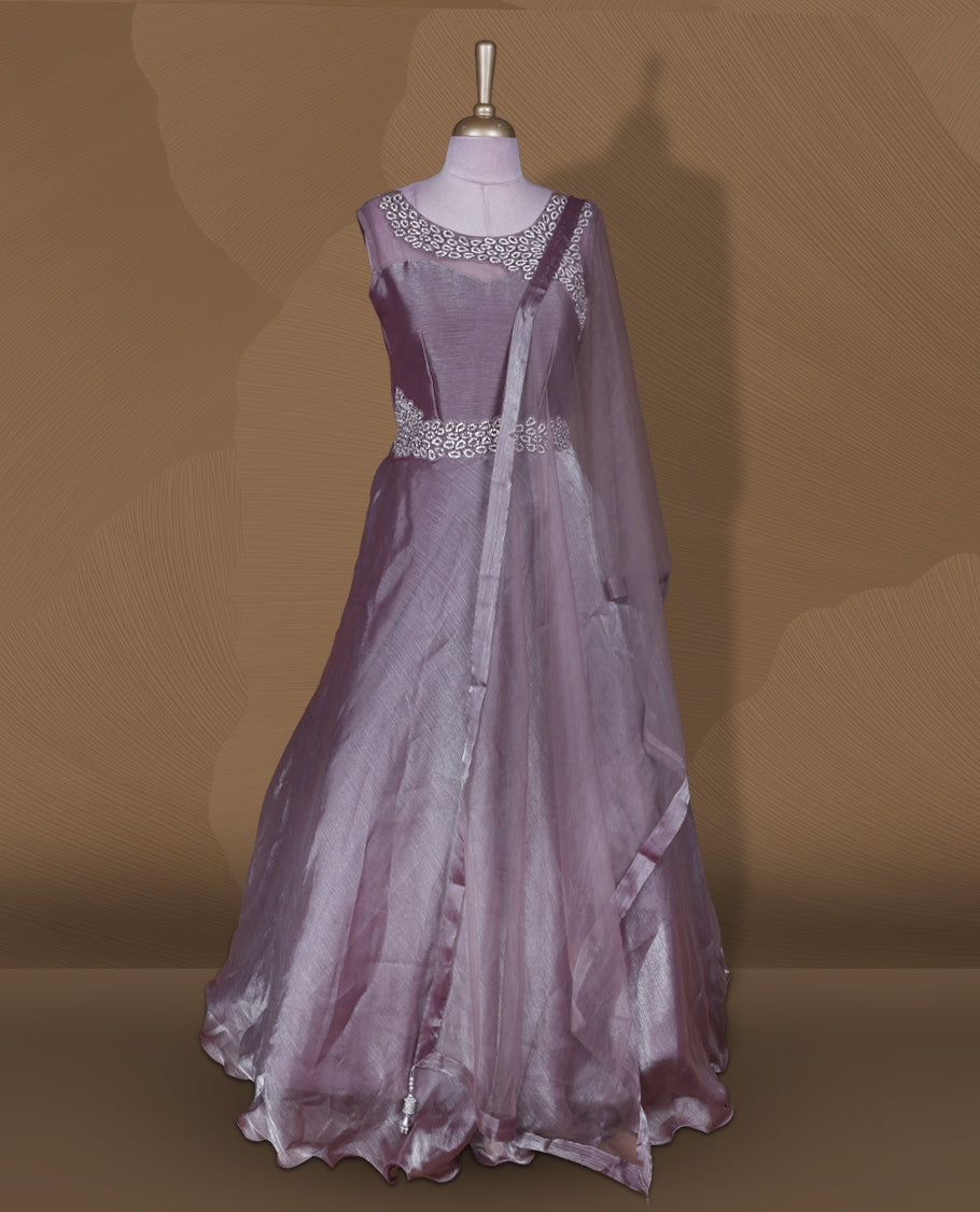 Dusty mauve colour stitched gown set with sleeveless embellished yoke, sheer studded back, flared layered hem with scalloped edge, and matching plain sheer dupatta.