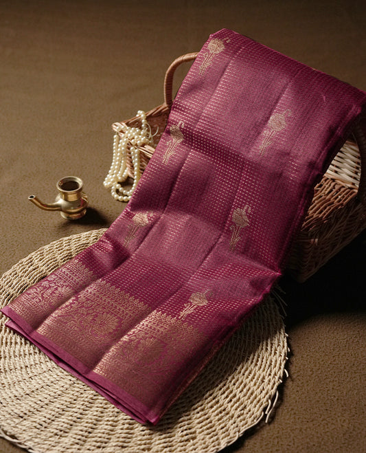 Maroon colour pure banarasi tussar Saree with antique design & golden motifs on the body, accentuated with an elegant traditional border, rich woven pallu and matching blouse piece.