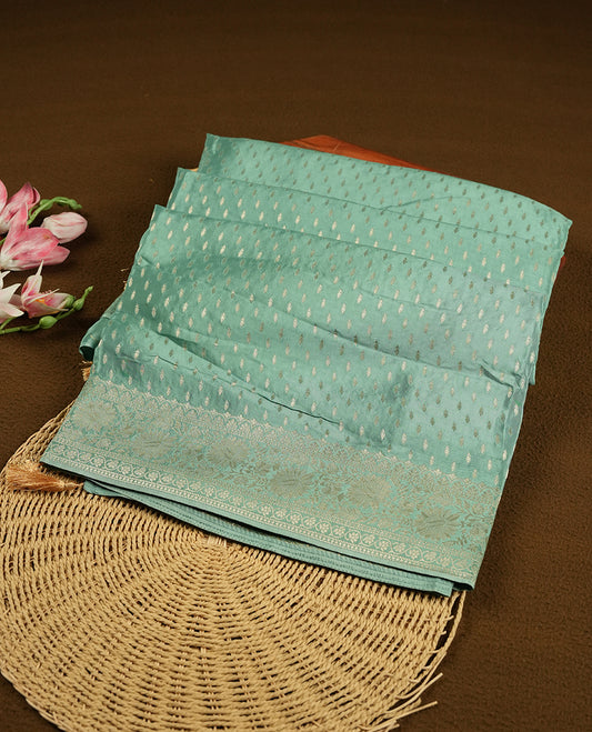 Pastel aqua colour banaras satin crepe saree fearturing gold tiny leaf motifs on body, kodi visiri pattern on border & pallu and paired with matching blouse