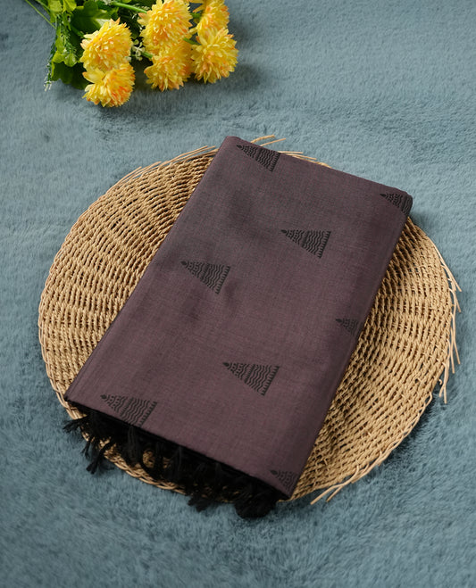 Black and Onion mix colour poly cotton saree with black temple motifs on the body, paired with a matching with black woven traditional border, and a coordinated all‑over geometric printed blouse piece.