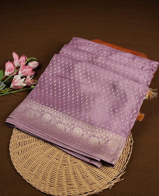Lavender colour banaras satin crepe saree fearturing gold tiny leaf motifs on body, kodi visiri pattern on border & pallu and paired with matching blouse