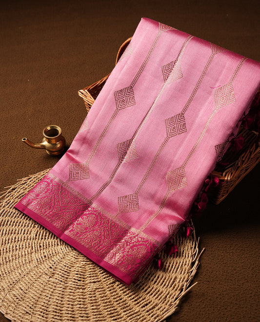 Pink Banaras soft silk saree with gold stripes with square motifs on body, with contrast magenta colour floral pattern on pallu, border, and Matching blouse.