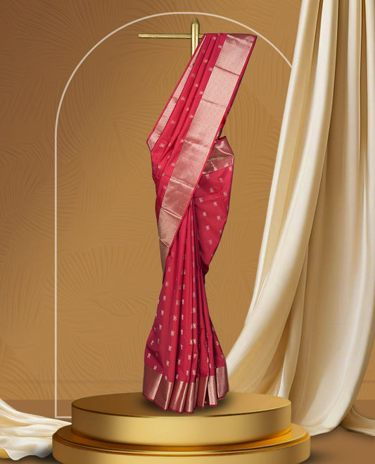 Raspberry pink colour soft silk saree featuring delicate zari buttas all over, paired with a lustrous golden zari border and pallu & Comes with a matching blouse.