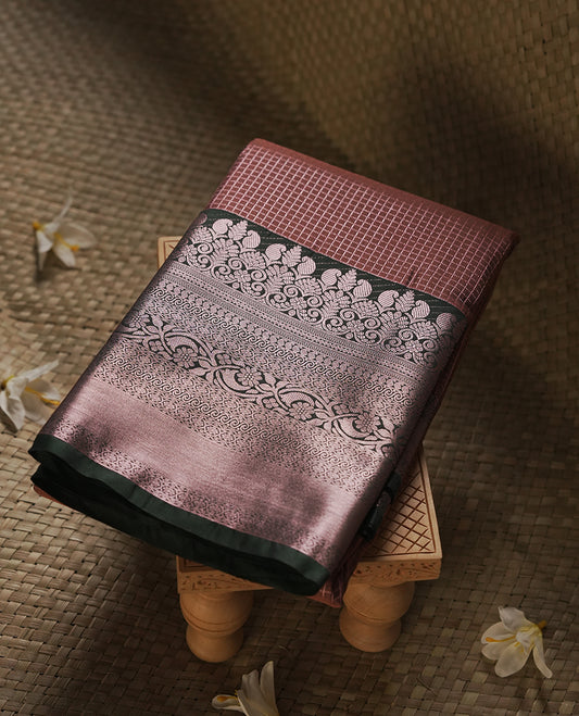 Rose taupe colour Semi Silk Saree with rose gold zari check pattern on the body, paired with a contrast Dark green colour pallu with rose gold zari traditioal border, and a matching blouse piece.