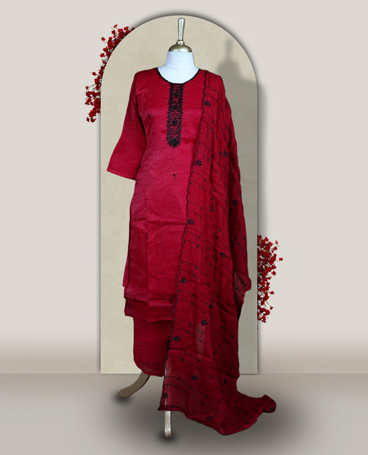 Maroon churidar set adorned with intricate black cut bead work on the neckline, paired with a matching bottom & The set comes with a lightweight embroidered dupatta, adding elegance and charm to your ethnic look.