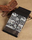 Black colour chanderi silk saree with gold zari strip pattern On body, compilmented by self colour border with antique zari pattern & white animal & forest print pattern and a matching blouse.