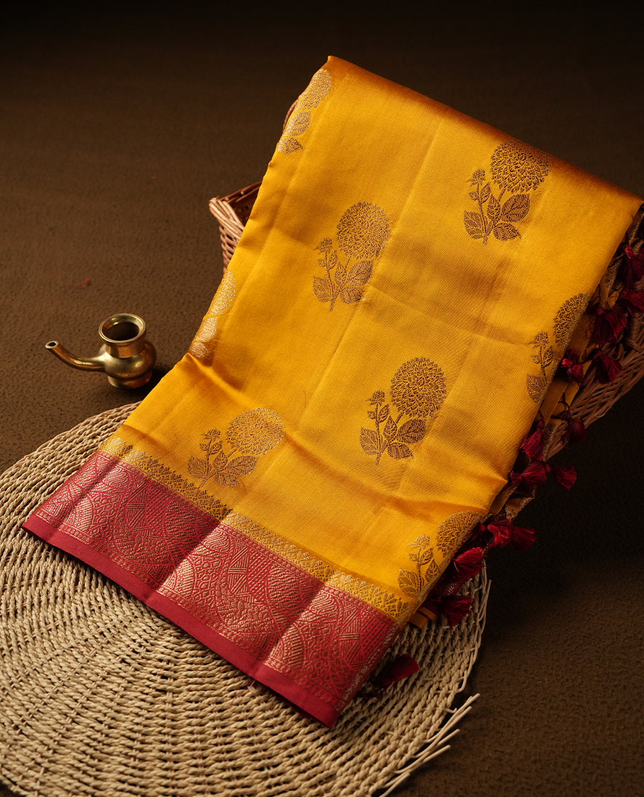 Mustard Colour Pure Banaras soft Silk Saree having gold floral motifs on Body with contrast Dark red colour gold Zari pattern on Border and matching Blouse