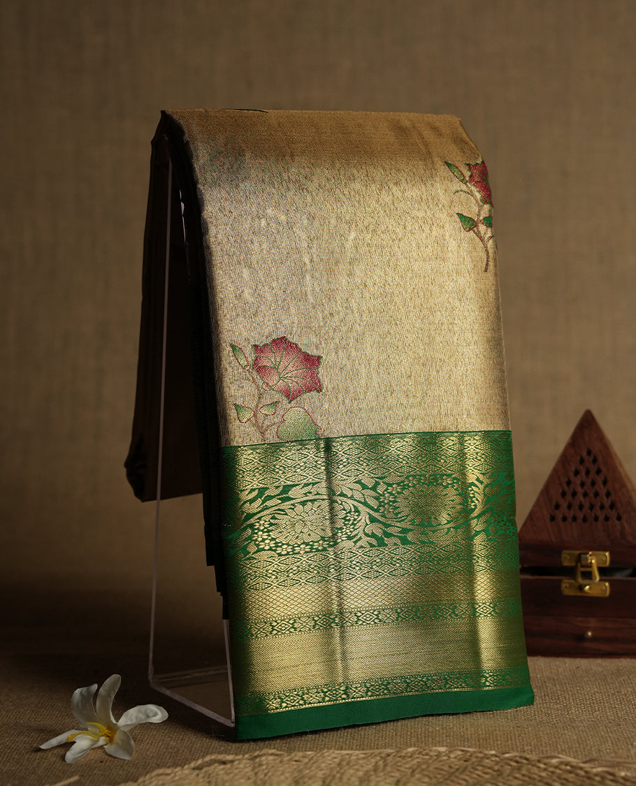 Antique golden Zari Tissue Brocade Saree features intricate a red colour flower Motifs on body and a green colour border & pallu with traditional patterns, paired with matching blouse
