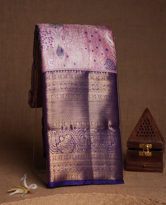 Pink colour and Antique gold Zari Tissue Brocade Saree features intricate blue colourred floral Motifs on body and a navy blue colour traditional border & pallu with floral patterns, paired with matching blouse
