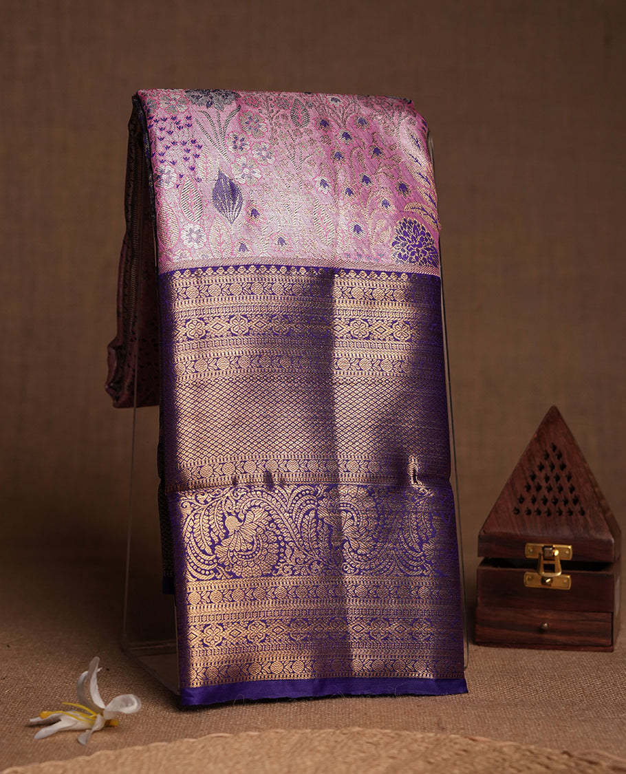 Pink colour and Antique gold Zari Tissue Brocade Saree features intricate blue colourred floral Motifs on body and a navy blue colour traditional border & pallu with floral patterns, paired with matching blouse