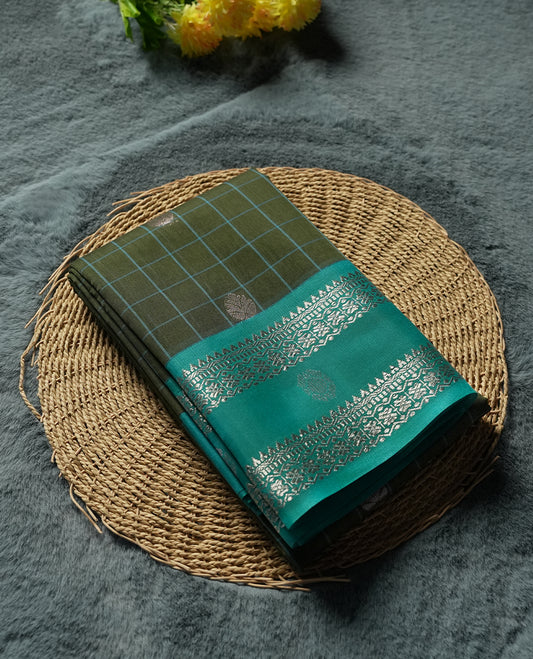 Olive Green Silk Cotton Saree with Silver Butta Body, Accented by Teal and Silver Zari Geometric Border on Teal Pallu, Paired with Matching Blouse Piece