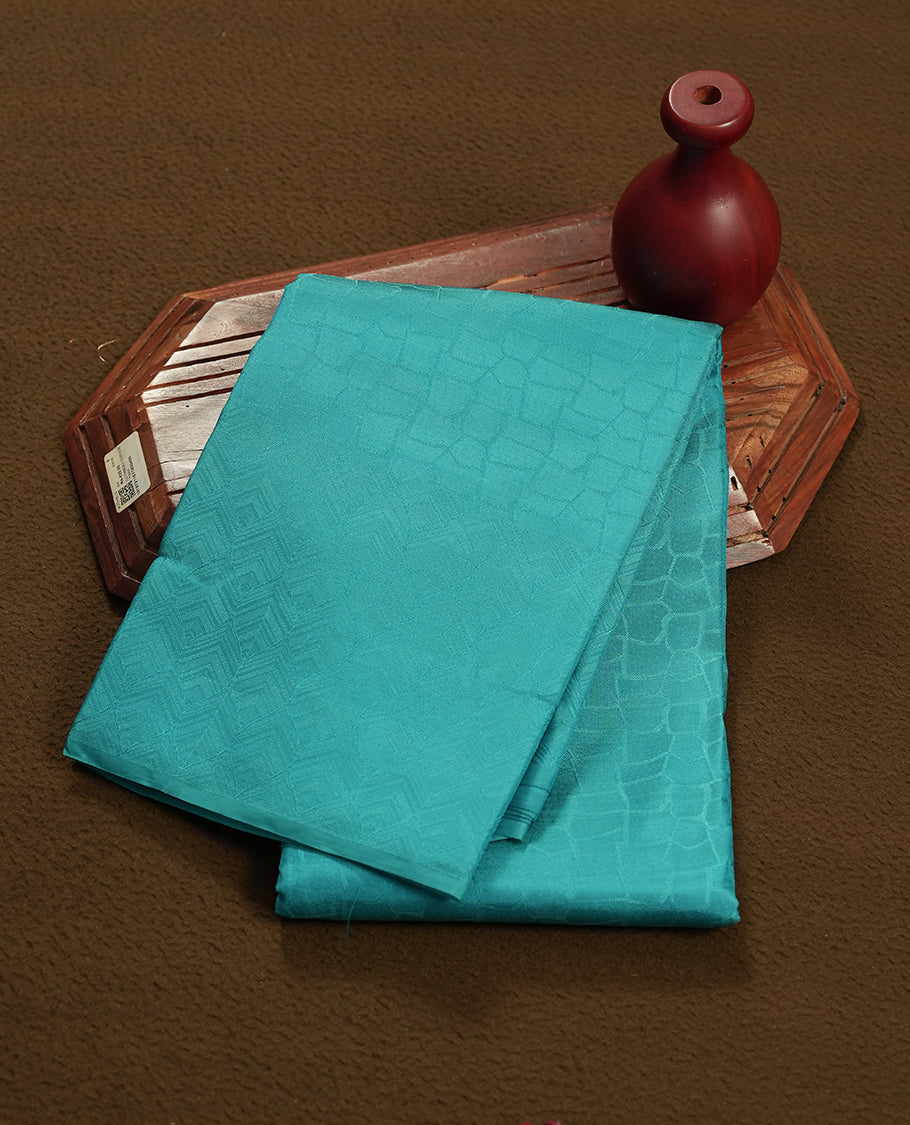 Aqua blue colour semi soft silk saree featuring a self coloured textured patterned body, complemented by self coloured motifes on pallu & border and a matching blouse piece.