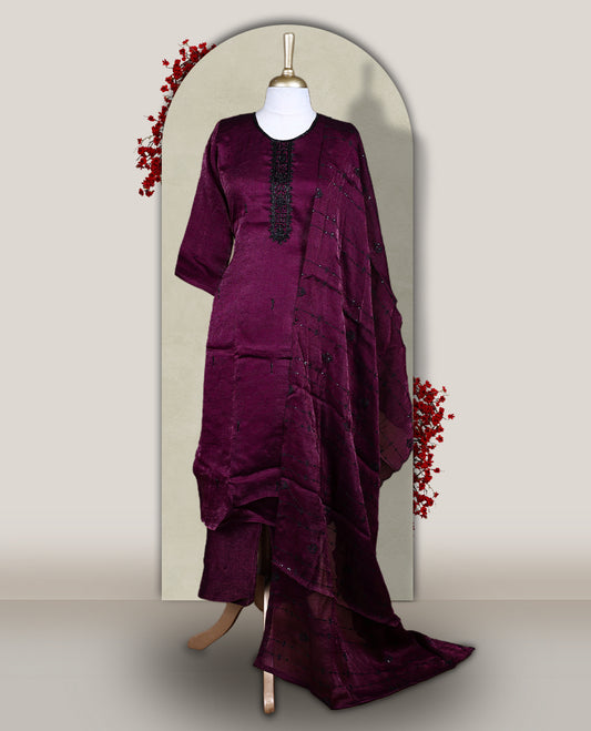 Grape colour  churidar set adorned with intricate black cut bead work on the neckline, paired with a matching bottom & The set comes with a lightweight embroidered dupatta, adding elegance and charm to your ethnic look.