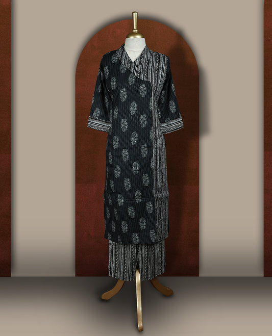 Black colour cotton coord set with floral and striped handblock prints, Features a stylish overlay design and elbow length sleeves & paired with matching striped wide leg pants.
