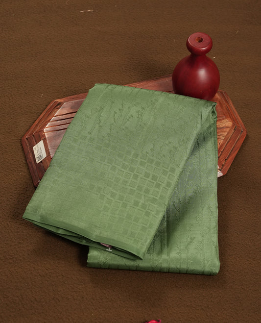 Dark pastel green colour semi soft silk saree featuring a self coloured patterned body, complemented by self coloured pallu & border and a matching blouse piece.