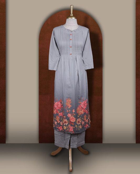 Grey colour coord set featuring a round neck kurta with pintuck detailing and wooden buttons, enhanced with vibrant floral prints along the hemline, paired with matching bottoms.