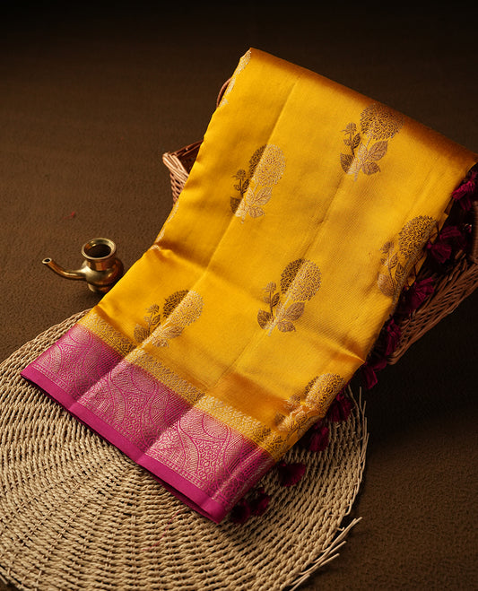 Mustard Colour Pure Banaras soft Silk Saree having gold floral motifs on Body with contrast Dark pink colour gold zari Border and matching Blouse
