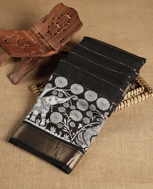 Black colour chanderi silk saree with gold zari strip pattern On body, compilmented by self colour border with antique zari pattern & white animal & forest print pattern and a matching blouse.