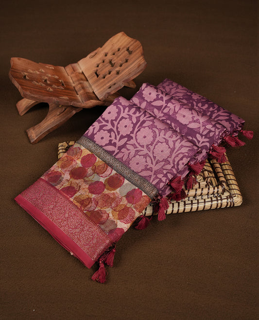 Purple colour chanderi silk saree featuring floral kodi print pattern across body, with contrast red colour border with zari pattern and paired with matching blouse.