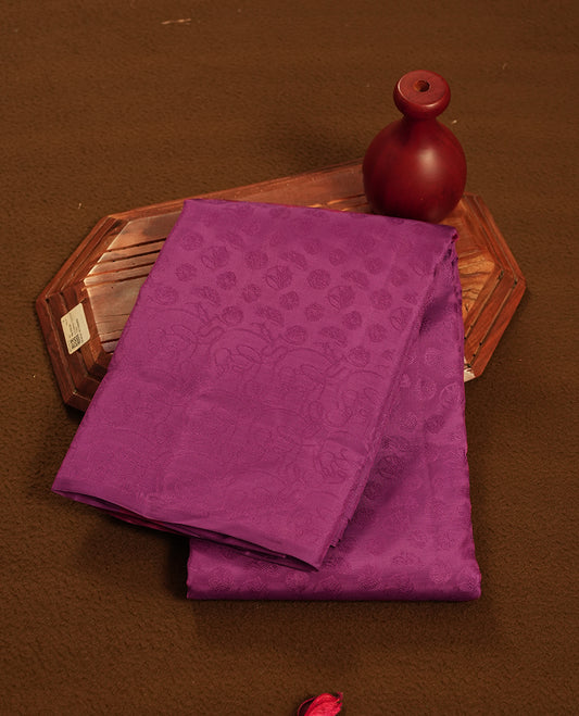 Radish colour semi soft silk saree featuring a self coloured textured patterned body, complemented by self coloured pallu & border and a matching blouse piece.