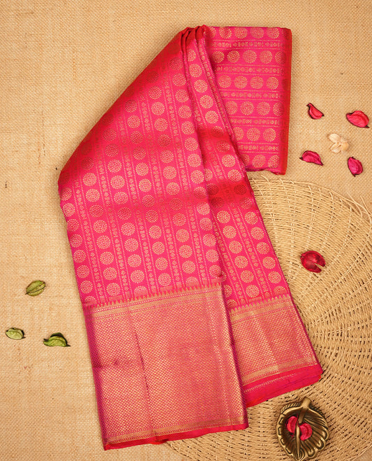 Rani pink colour Kanchipuram Samudrika Silk Saree featuring Poo chakram & strip pattern weaving with gold zari jacquard and a traditional zari border, paired with a matching designer jacquard blouse piece
