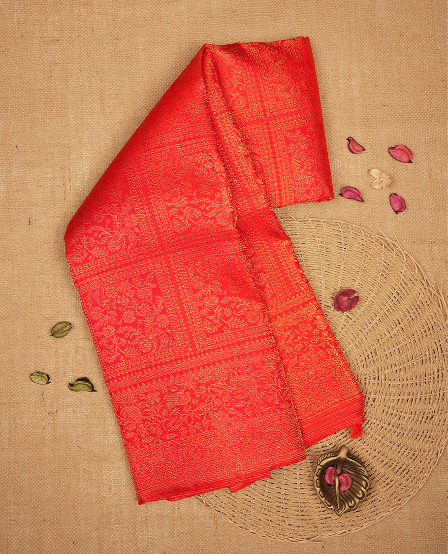 Red Kanchipuram Samudrika Silk Saree featuring Floral kodi in square pattern weaving with light gold zari jacquard and a traditional zari border, paired with a matching designer jacquard blouse piece