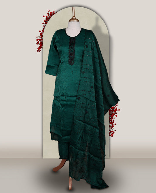 Green colour churidar set adorned with intricate black cut bead work on the neckline, paired with a matching bottom & The set comes with a lightweight embroidered dupatta, adding elegance and charm to your ethnic look.