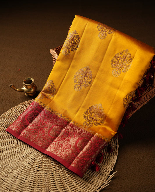 Mustard Colour Pure Banaras soft Silk Saree having gold floral motifs on Body with contrast Dark red colour gold Floral kodi pattern on Border and matching Blouse