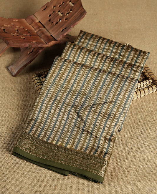 Cream colour chanderi silk saree with Olive & blue geometric stripped printed On body, compilmented by contrast olive colour border with golden zari floral pattern and a matching blouse.