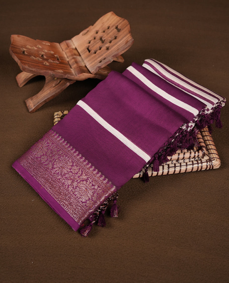 Purple colour chanderi silk saree featuring white stripped print pattern across body, with Antique zari pattern border and paired with matching blouse.