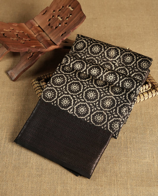 Black colour chanderi silk saree with Floral block print On body, compilmented by self colour border with antique zari pattern and a matching blouse.