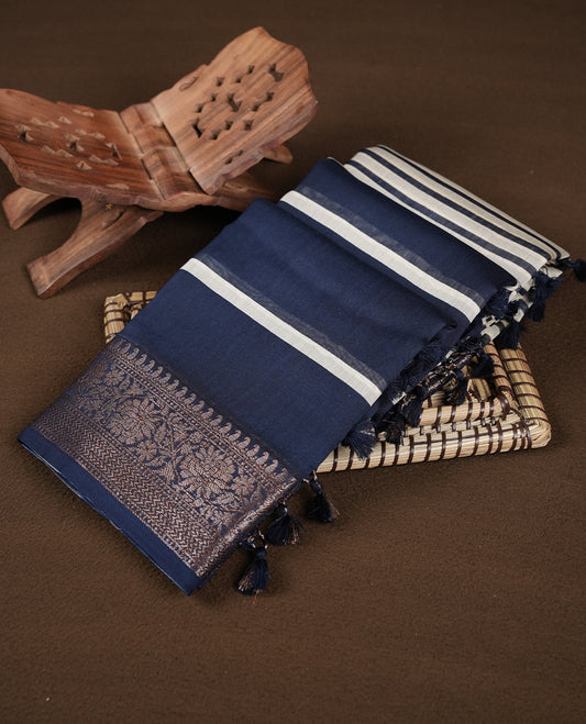 Dark blue colour chanderi silk saree featuring white stripped print pattern across body, with Antique zari pattern border and paired with matching blouse.
