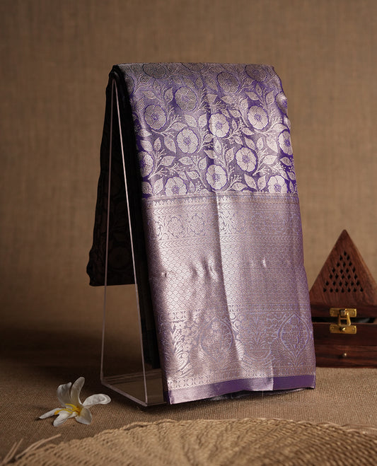 Purple colour and Antique silver Zari Tissue Brocade Saree features intricate Motifs on body and traditional border & pallu with floral patterns, paired with matching blouse