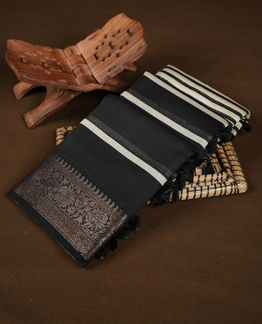 Black colour chanderi silk saree featuring white stripped print pattern across body, with Antique zari pattern border and paired with matching blouse.
