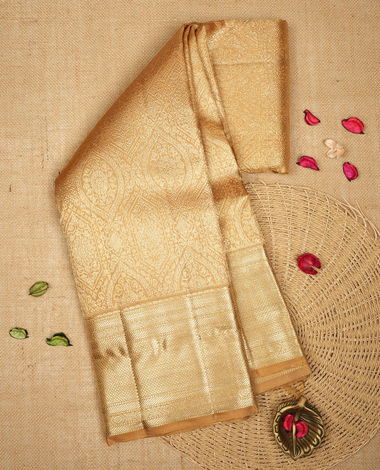 Gold colour Kanchipuram Samudrika Silk Saree featuring patterns weaving with gold zari jacquard and a traditional zari border, paired with a matching designer jacquard blouse piece