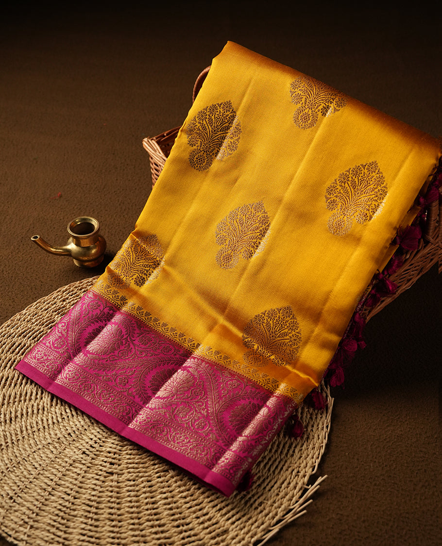 Mustard Colour Pure Banaras soft Silk Saree having gold floral motifs on Body with contrast Dark pink colour gold floral kodi pattern on Border and matching Blouse